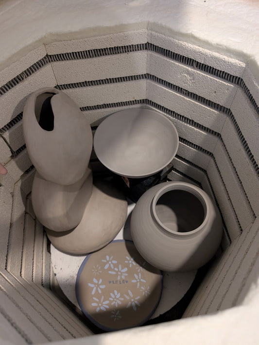 Ceramic pieces loaded inside the kiln before firing