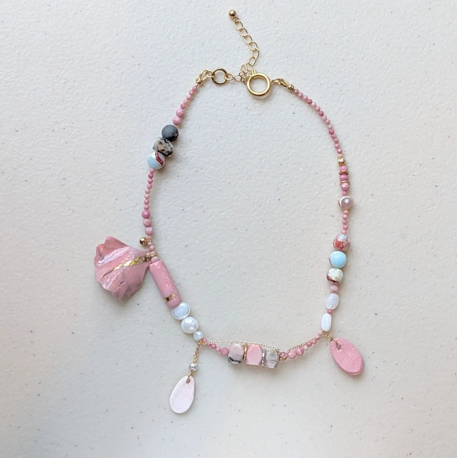 Playful Pink Hue Necklace - Featuring natural stones and pearls with hand-made porcelain charms