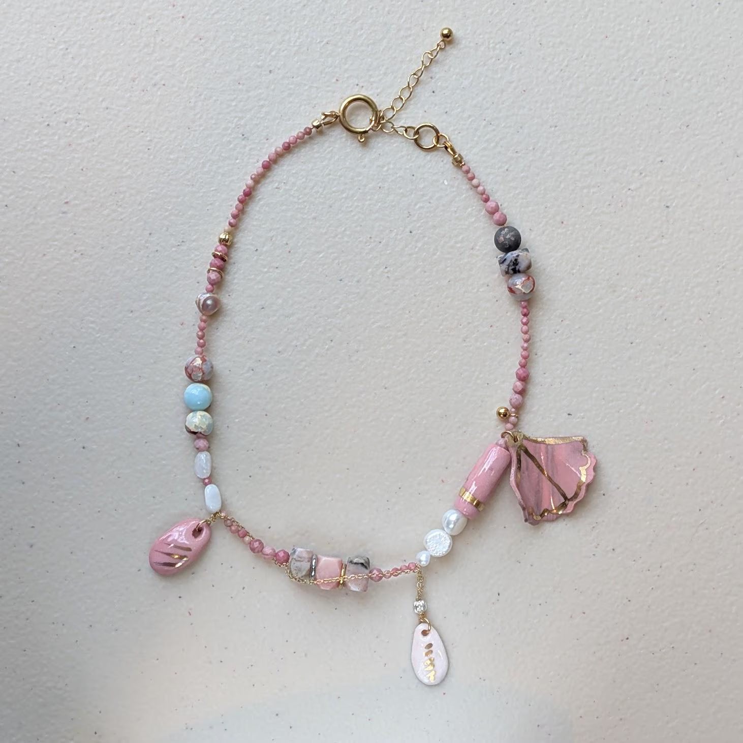 Playful Pink Hue Necklace - Featuring natural stones and pearls with hand-made porcelain charms